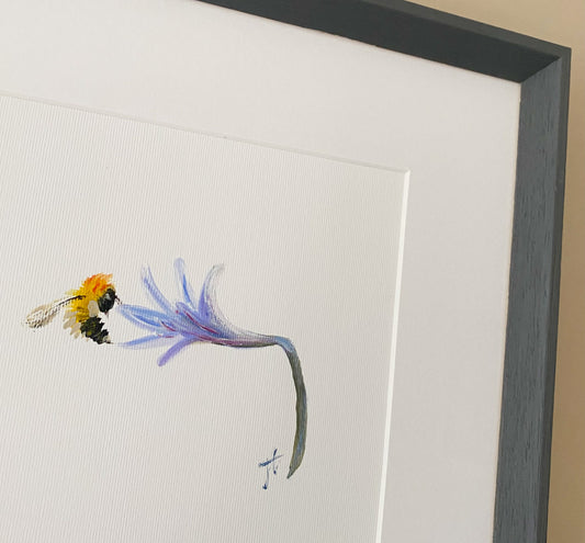 Detail of framed painting of bee and agapanthus flower