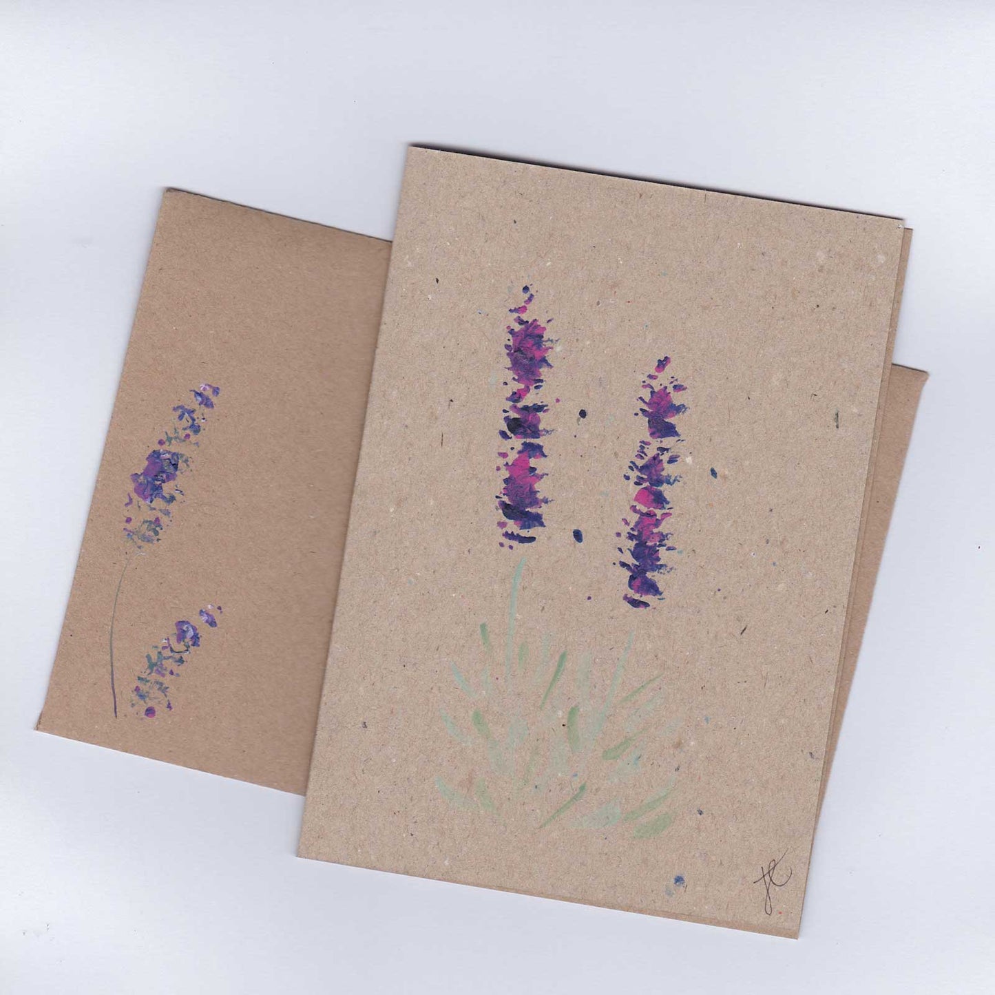 Kraft paper card and envelope with purple lavender flower designs on a white background