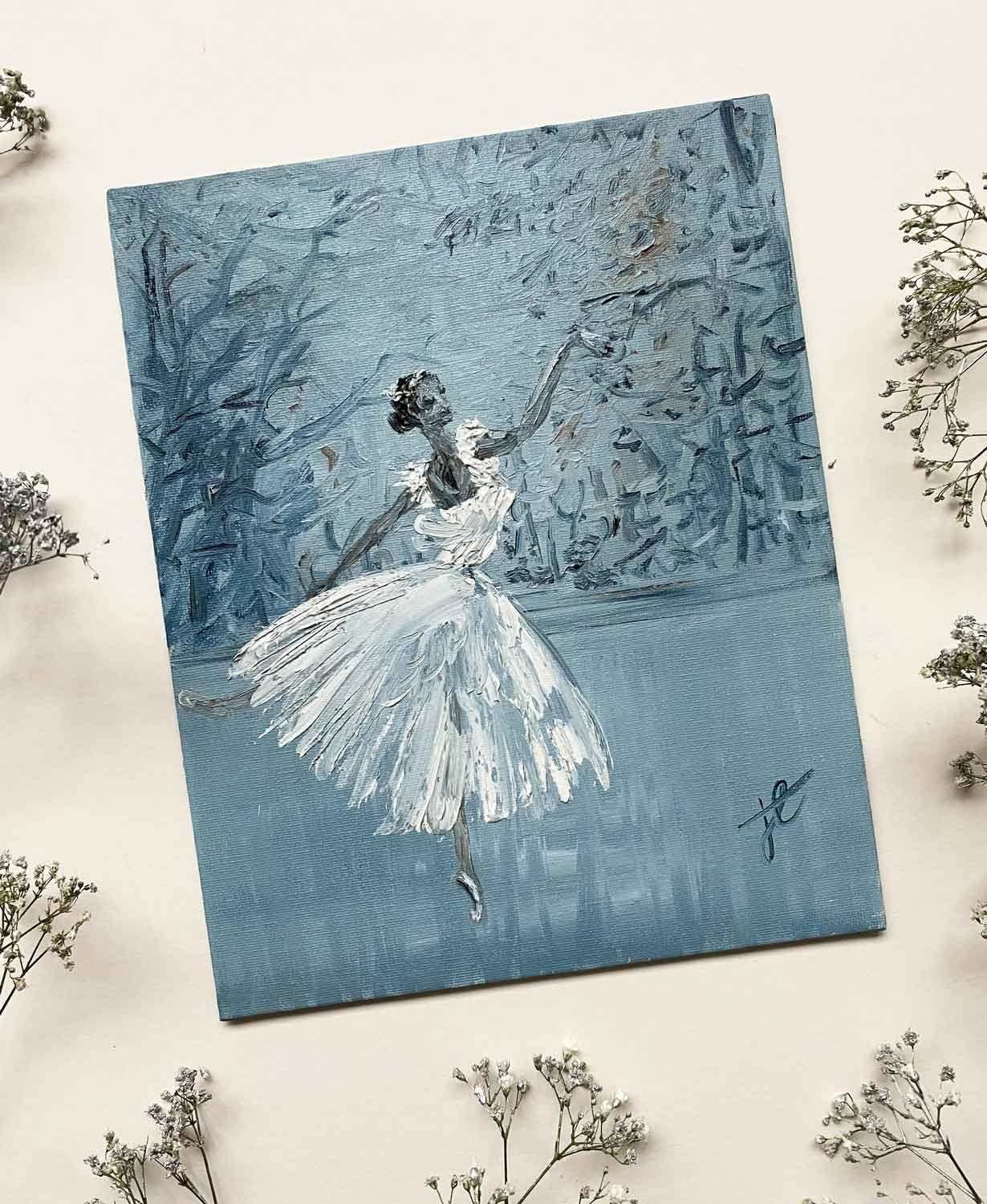 Ballerina painting of figure poised in romantic tutu in forest setting with white and grey colour palette