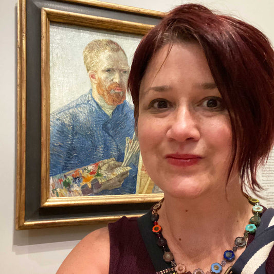 Jeanne-Louise standing in front of Van Gogh self-portrait