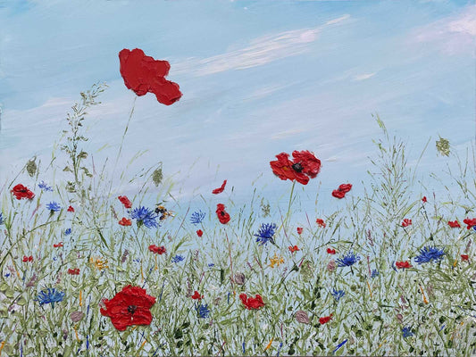 Textured painting of a field of wildflowers with red poppies and blue cornflowers against a blue sky.