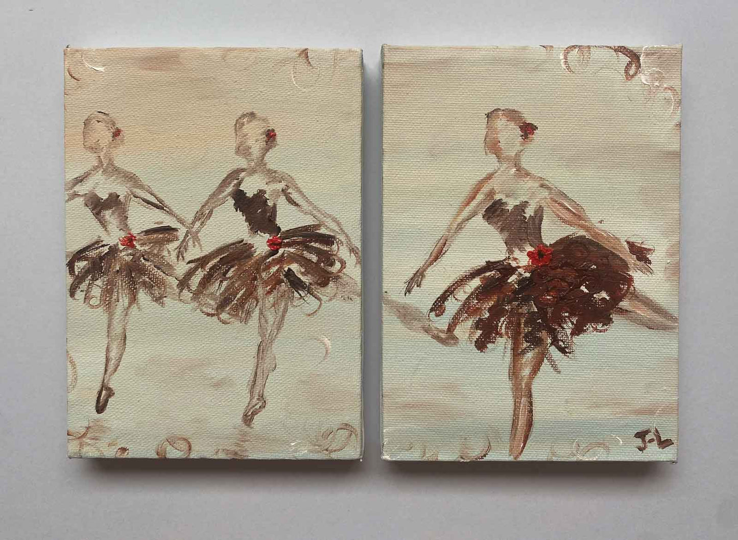 Diptych painting with 3 ballerinas poised in arabesque. Shown against grey background