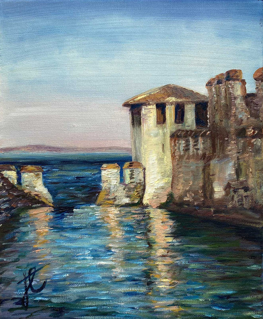 Painting of Italian building by a lake with a blue sky and mountains in the distance.